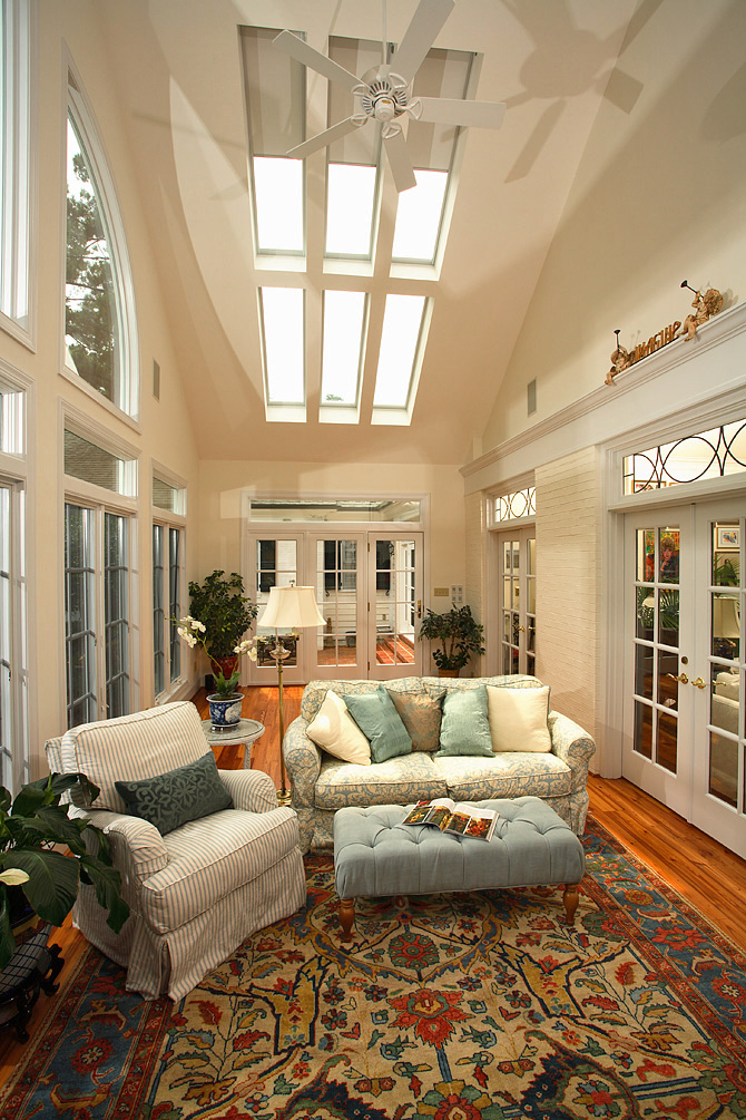 Sunroom Addition with custom Entertainment system, heart pine flooring and skylights
