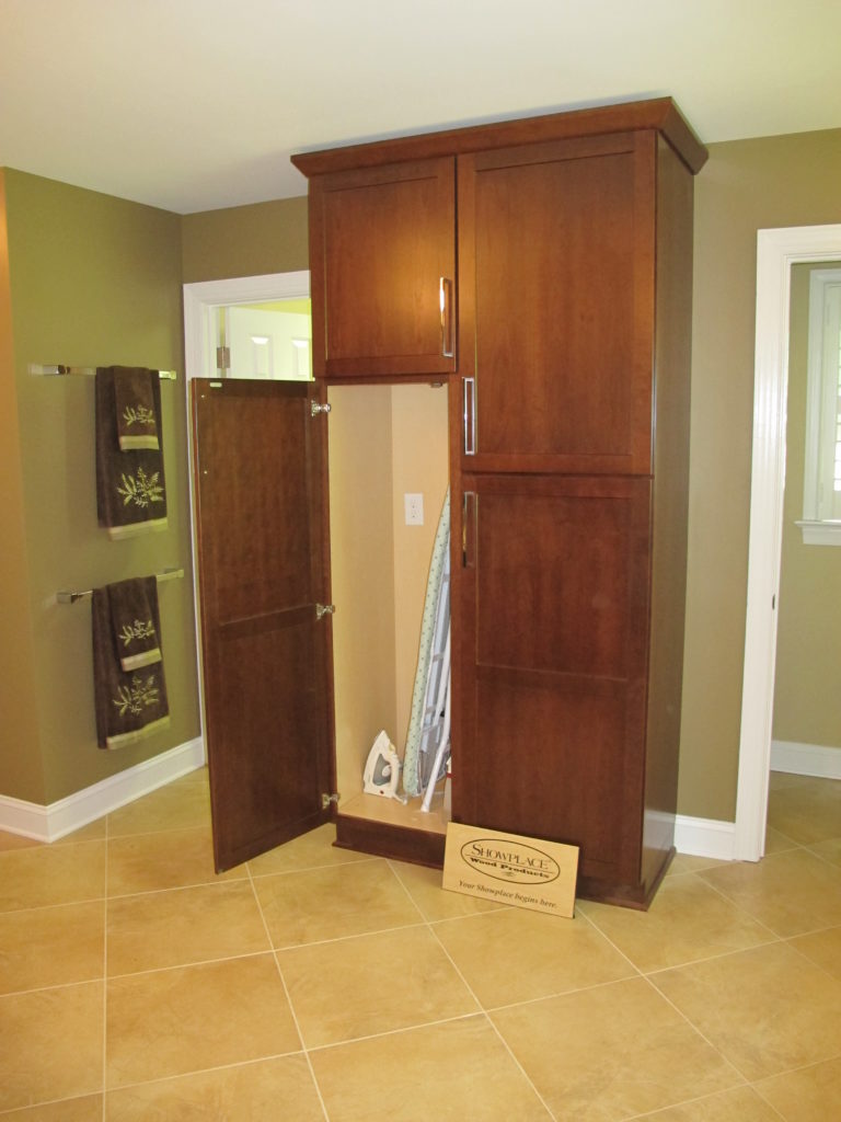 Ironing board in cabinet in owners bathroom