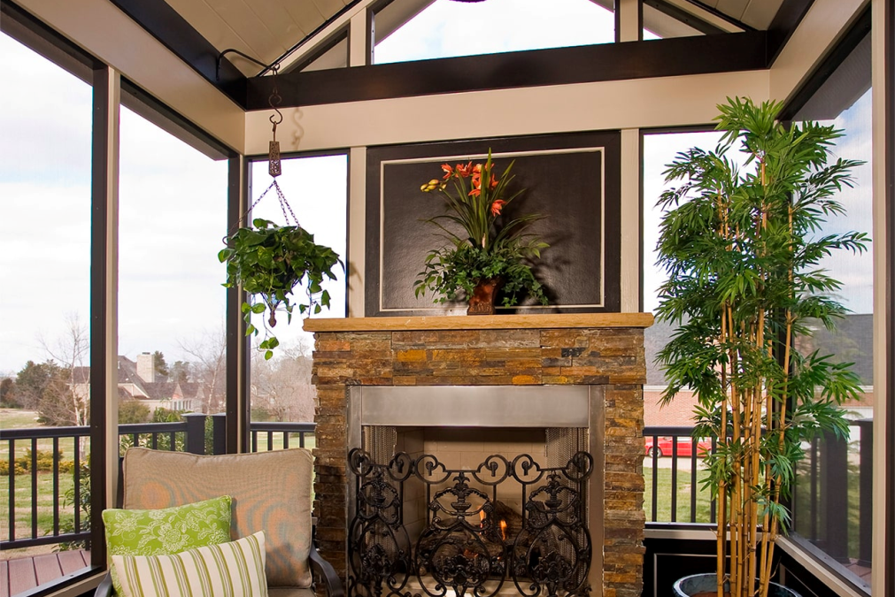 A beautiful fireplace remodel featuring a wrought iron gate.